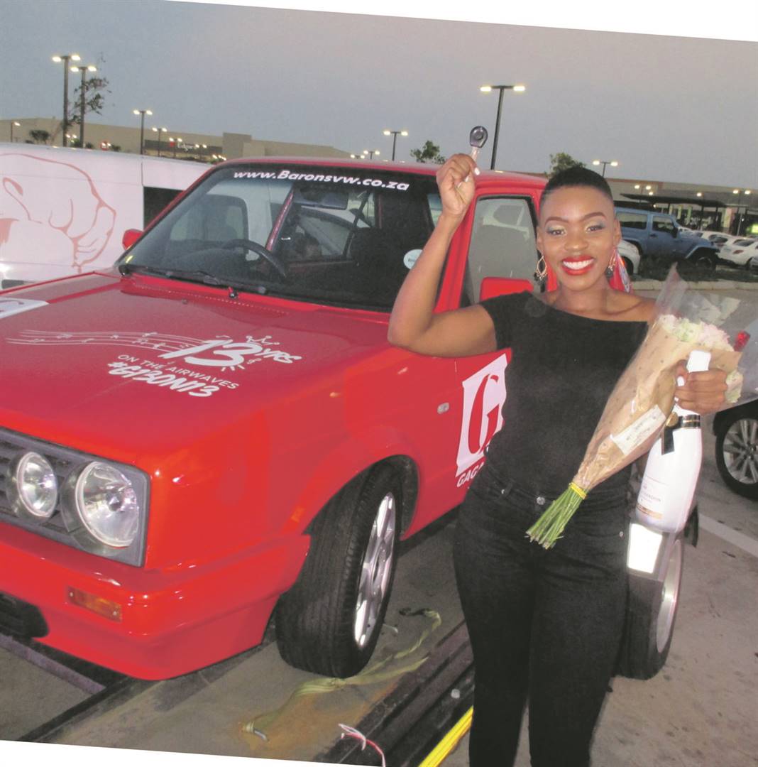 Nokwanda Zondi stands next to the VW Golf that she won from Gagasi FM.       Photo by              Mbali Dlungwana