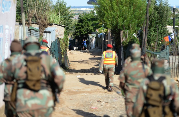 Members of South African National Defence Force patrol the streets of Diepsloot in Johannesburg. (Felix Dlangamandla/Gallo Images)