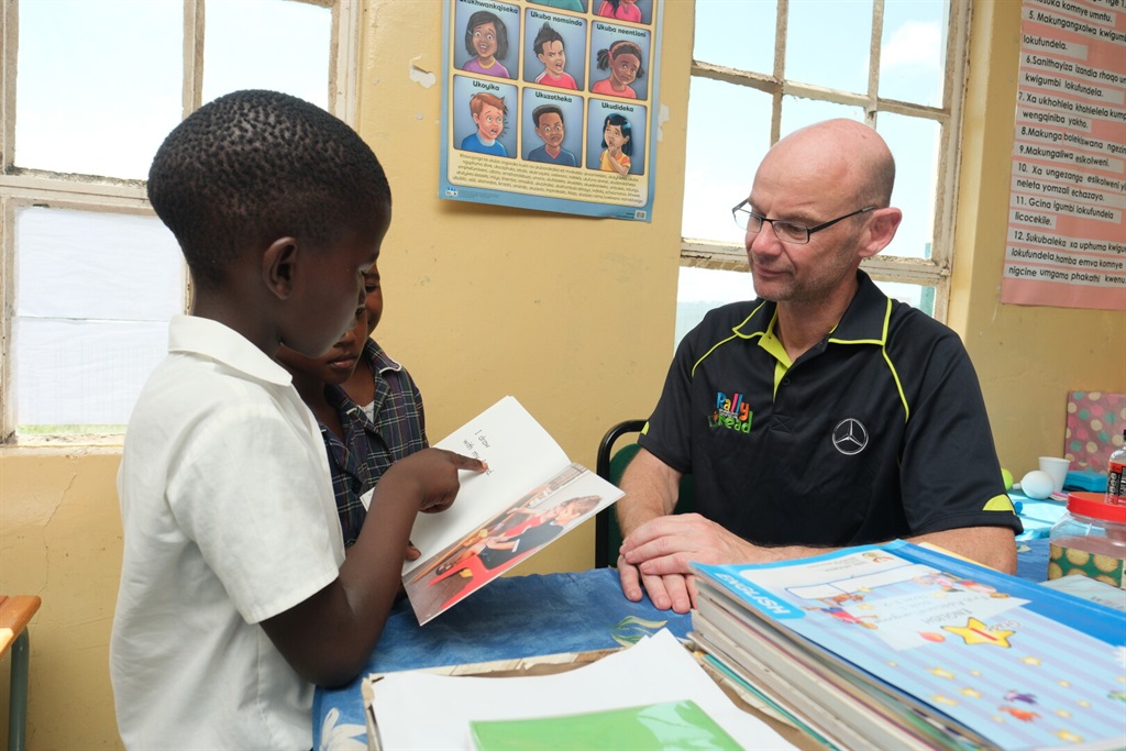 Learner reading to CEO and Executive director of M