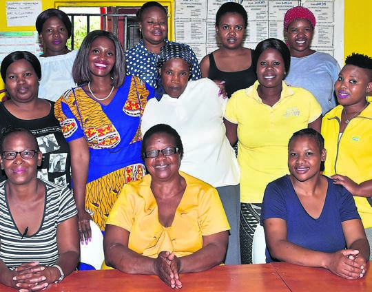 Agnes Magodzho (middle, front) and her team run the Lotsha support organisation. 