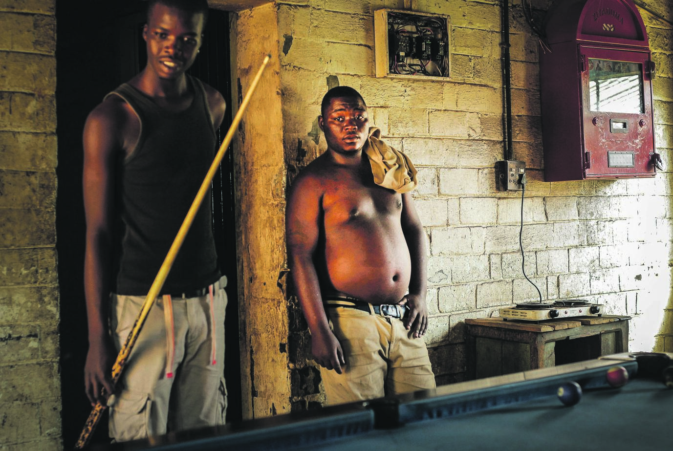 Sithembiso Madondo (left) and Thandani Dladla play pool at Ndana Tavern in Soweto during a week day. Scores of jobless people wander around their townships just to pass the time as their prospects of finding employment diminish by the day Picture: Mpumelelo Buthelezi