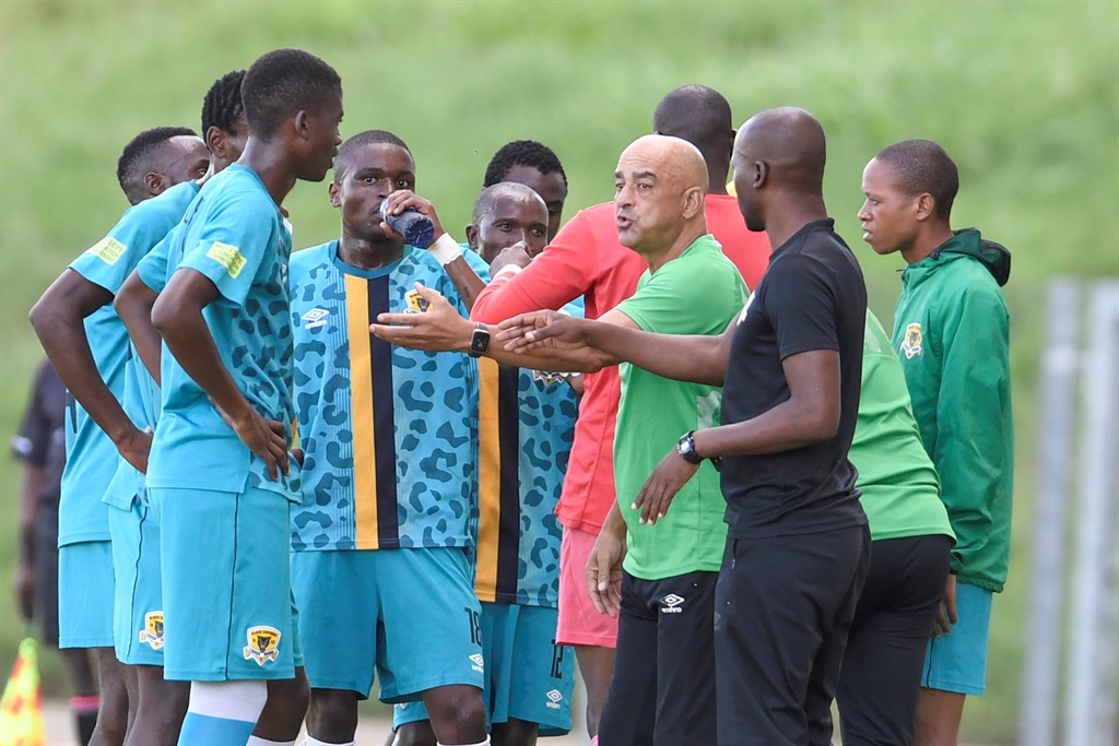 Black Leopards coaches Morgan Shivambu, Owen Da Gama speaks to players during the Motsepe Foundation Championship match between JDR Stars and Black Leopards at Soshanguve Giant Stadium on February 22, 2023 in Pretoria, South Africa. 