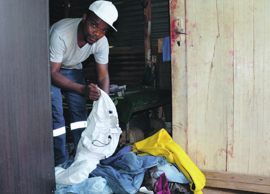 Tshepo Mofokeng takes back the clothes that were stolen from him last year.   Photo by Morapedi Mashashe