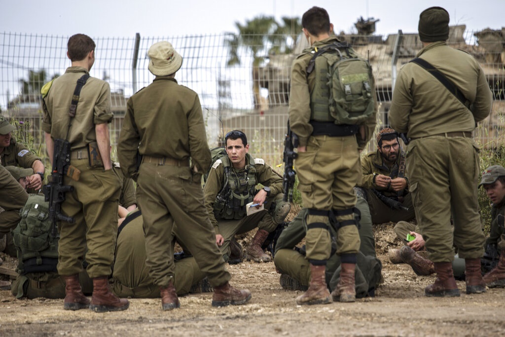 Israeli soldiers near the Israel Gaza border. (Tsafrir Abayov, AP)