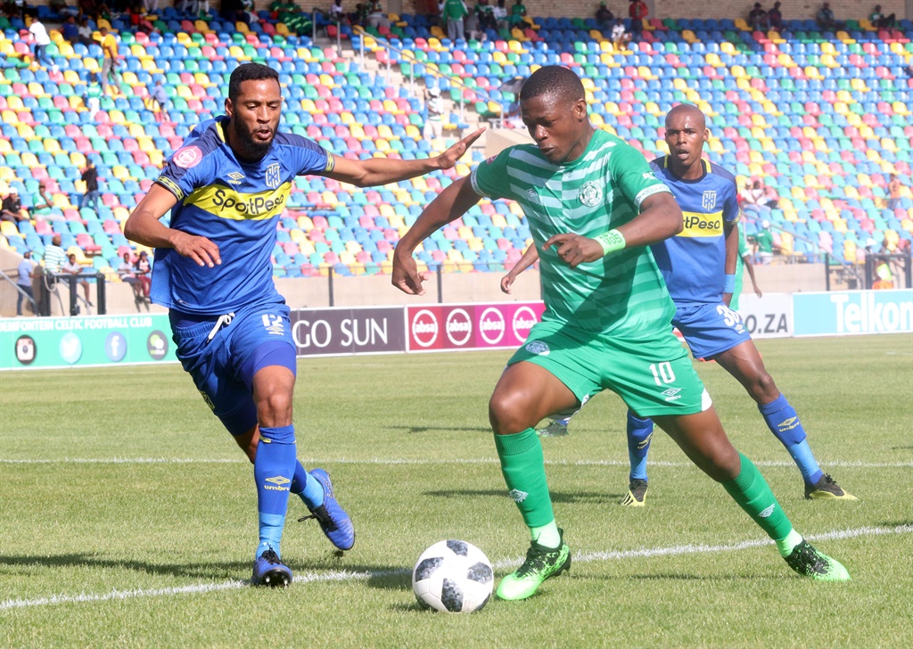 Taaritq Fielies of Cape Town City challenges Ndumiso Mabena of Bloemfontein Celtic during the Absa Premiership match.