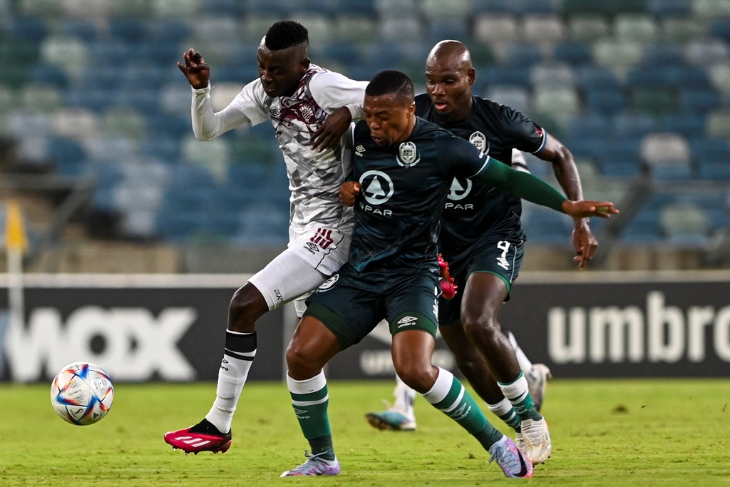 DURBAN, SOUTH AFRICA - APRIL 01: Thembela Sikhakhane of AmaZulu FC and Tshediso Patjie of Swallows FC during the DStv Premiership match between AmaZulu FC and Swallows FC at Moses Mabhida Stadium on April 01, 2023 in Durban, South Africa. (Photo by Darren Stewart/Gallo Images)