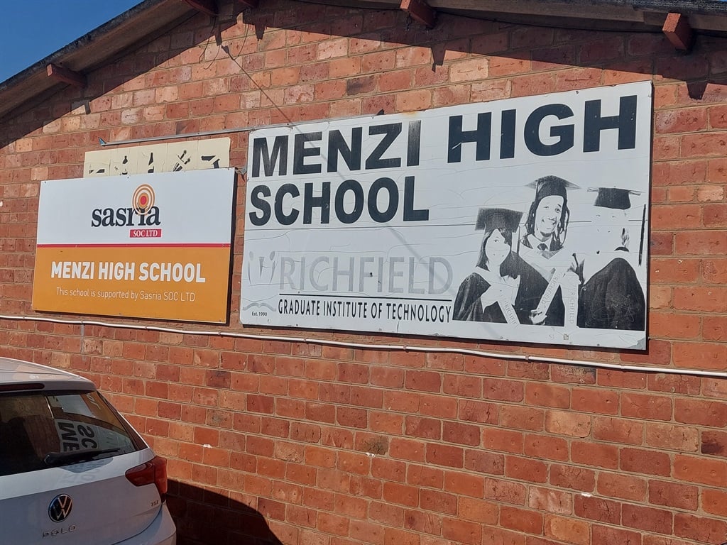The extension of Menzi High School will be delayed by a year following at least six attempts to stop construction by armed gangs demanding to be paid 30% of the project's budget. 