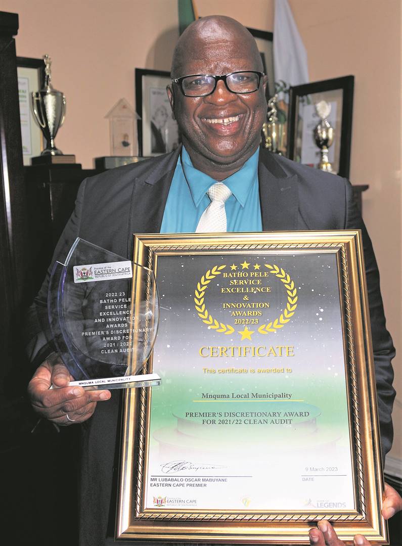 Mnquma Local Municipality municipal manager Silumko Mahlasela with the accolade the municipality received at the Batho Pele Service Excellence Awards for achieving its first clean audit opinion.                          
