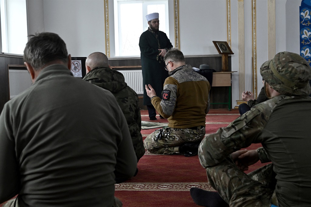 This photograph taken on March 31, 2023, shows worshippers gathered for Friday prayer at a mosque near the eastern front line, amid the Russian invasion of Ukraine.