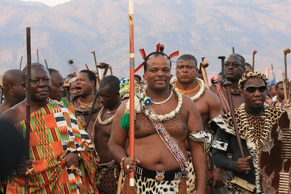 King Mswati III (C) watches the Umhlanga dance in 