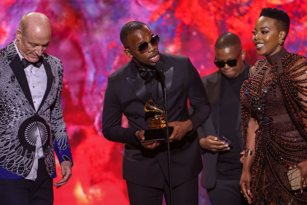 Wouter Kellerman, Zakes Bantwini and Nomcebo Zikode accept the Grammy Award for Best Global Music Performance at the 65th Grammy Awards.