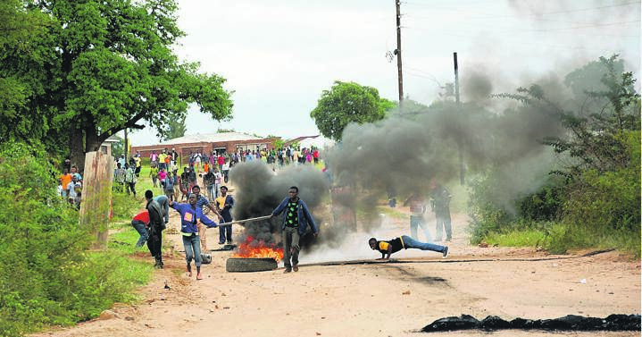 STILL FIGHTING Vuwani residents burn tyres and block roads in protest against having been rezoned from Makhado. Picture: Joshua Sebola