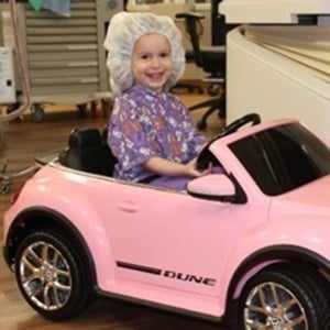 Children use the mini cars to drive themselves to the operating room. (Photo: Facebook)