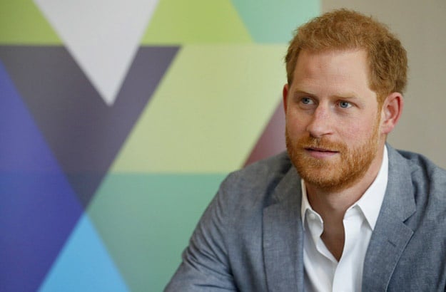 Prince Harry, Duke of Sussex listens to the Youth Ambassadors Mental Health Champions during a visit to YMCA South Ealing, to learn more about their work on mental health and see how they are providing support to young people.