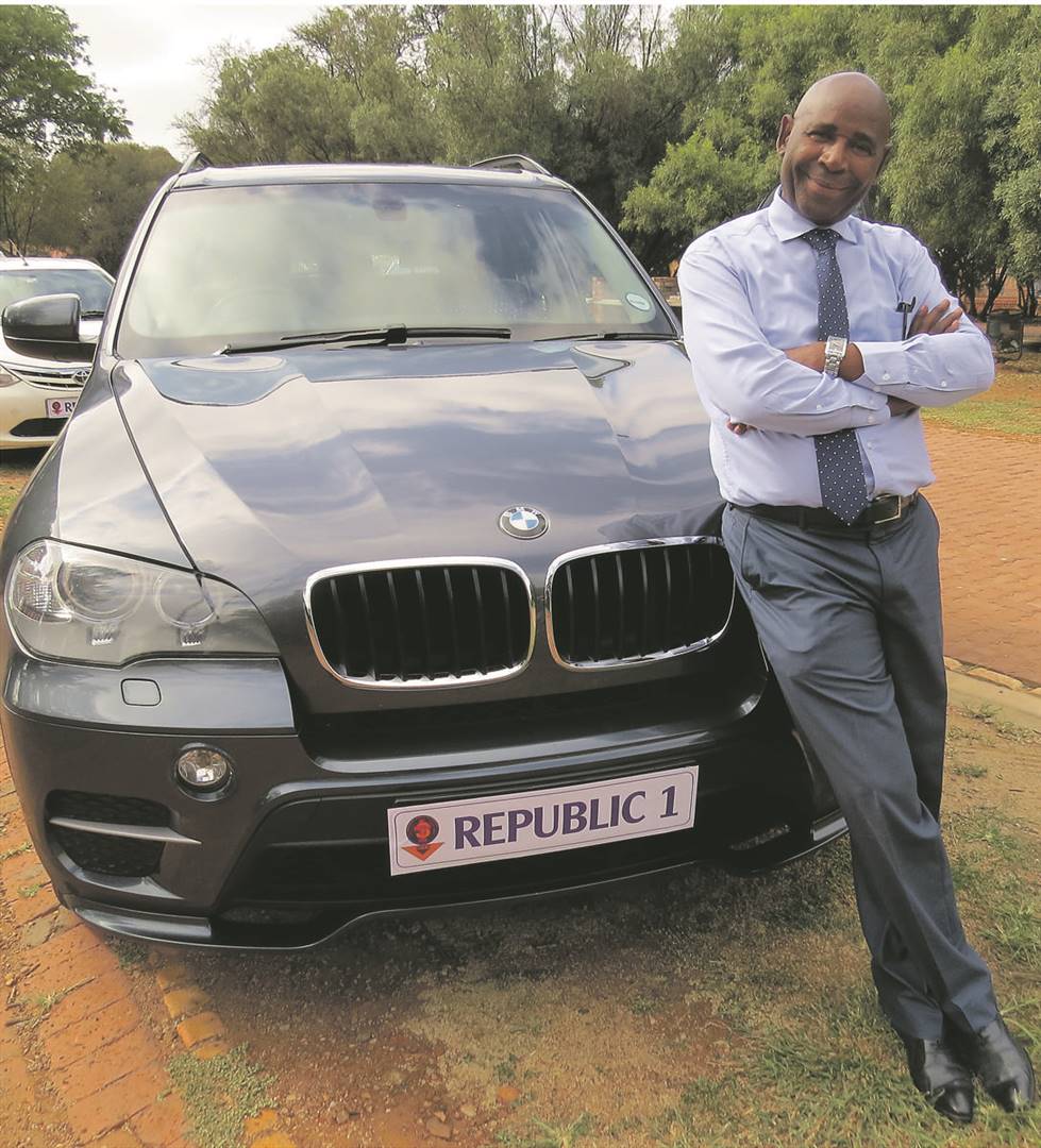 John Sejamo poses with his black BMW X5 in Central Jabavu, Soweto.           Photos by Sammy Moretsi