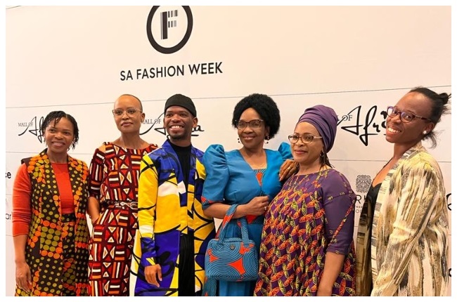 Athenkosi, one of the young designers who got to showcase their genderless and ready-to-wear clothing brand - Artae Original, on the first day of SA fashion week and his proud family. 