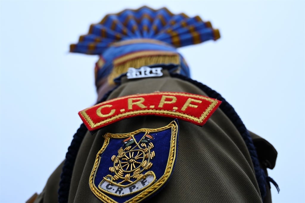 An Indian Central Reserve Police Force (CRPF) soldier stands in a formation.