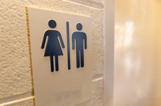 Unisex Bathroom sign with male and female symbols.