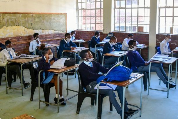 "The DBE needs to build more classrooms at existing schools, hire more educators and bring the ratio of teachers to pupils to 1:25". (Getty Images) 