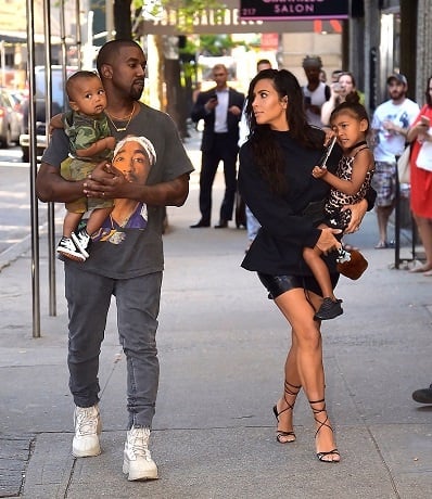 Kim Kardashian and Kanye West out and about with North and Saint West.  