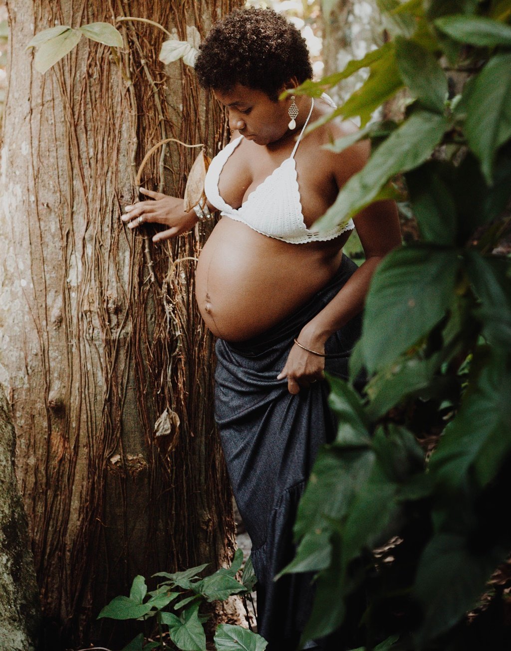A woman celebrates her pregnancy with a shoot