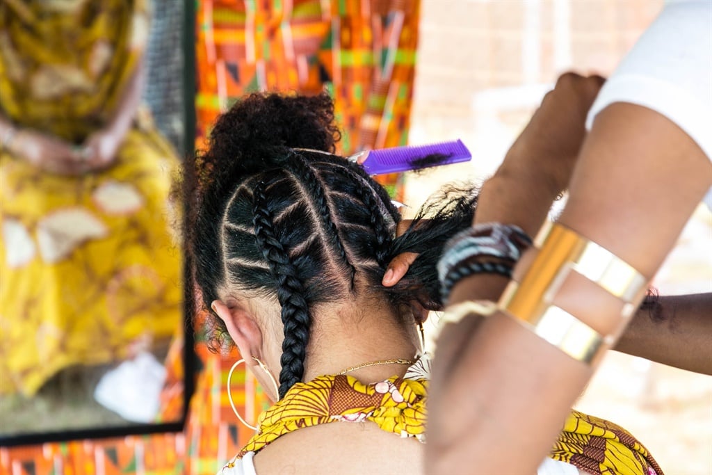 A woman getting her braiding can sometimes risk traction alopecia