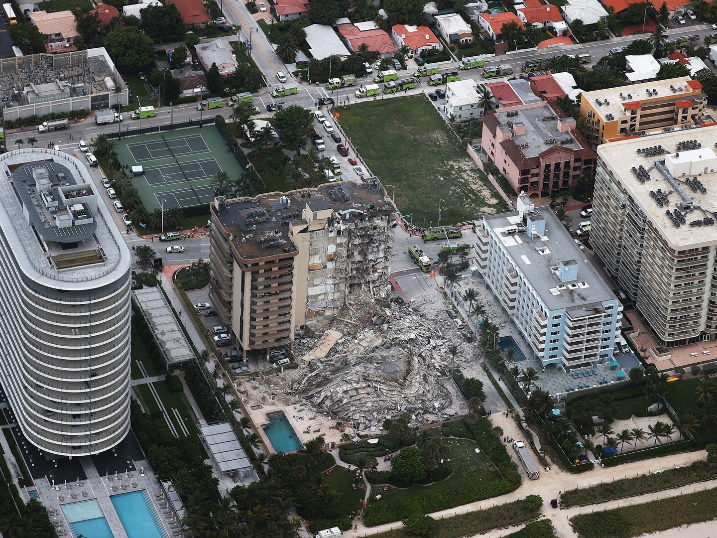Firefighters and dangling rubble: Photos show devastation after a high ...