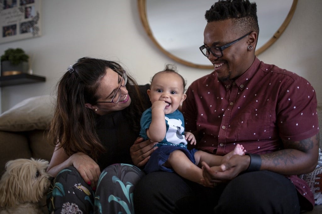 Cheryl and her husband Mpho Mojapelo with their child. Credit: Gulshan Khan