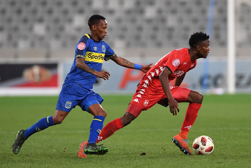 Highlands Park's Sphiwe Mahlangu being marshaled by Cape Town City's Surprise Ralani.
(Photo by Ashley Vlotman/Gallo Images)