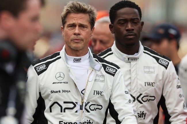 Brad Pitt and Damson Idris walk the grid during filming of their new F1 movie, Apex. The movie was shot at the Silverstone Circuit in Northampton, England. (PHOTO: Gallo Images/Getty Images)