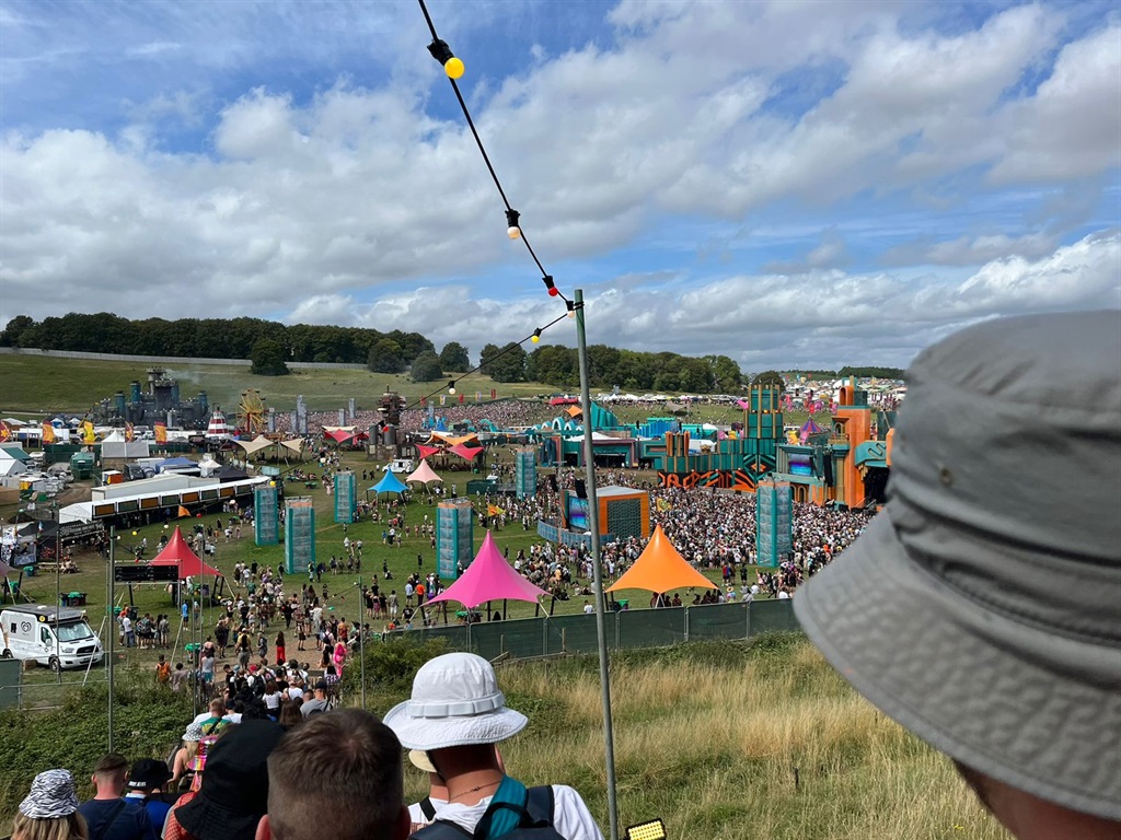 Festival goers make their way to the stages at Boomtown Festival underway in the UK.
