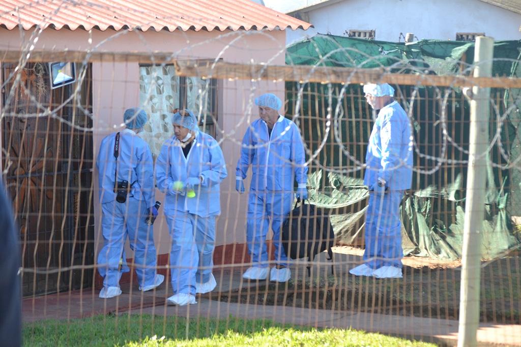Police forensic at the crime scene where six people were killed in Kwanobuhle. Photo by Luvuyo Mehlwana