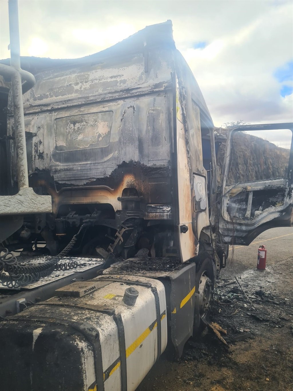 An alleged arsonist was caught camera pouring what seems like an inflammable liquid in one of the trucks on Wednesday.