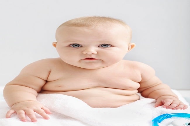 Chubby baby in a towel. 