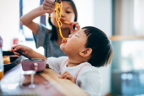 Kids eating 2 minute noodles