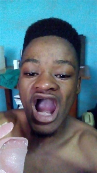 Sphamandla Dzanibe showing his toothless mouth. 