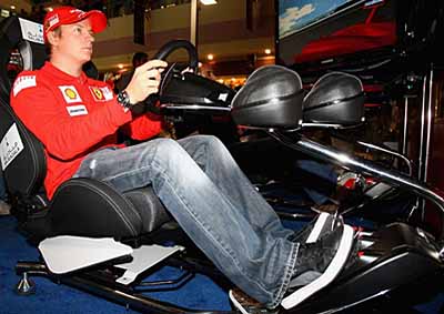 NAKED DRIVER: Kimi Raikkonen doing what he loves best - but on a simulator.
