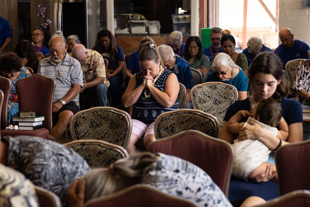 Survivors and churchgoers pray