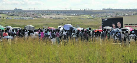  Election day in Olievenhoutbosch – outside Centurion on the road between Pretoria and Sandton – and all have come to vote. Long queues in the sun does not keep people away Picture: Craig Nieuwenhuizen