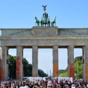 Climate activists demanding an end to fossil fuels spray-paint iconic Brandenburg Gate in Berlin