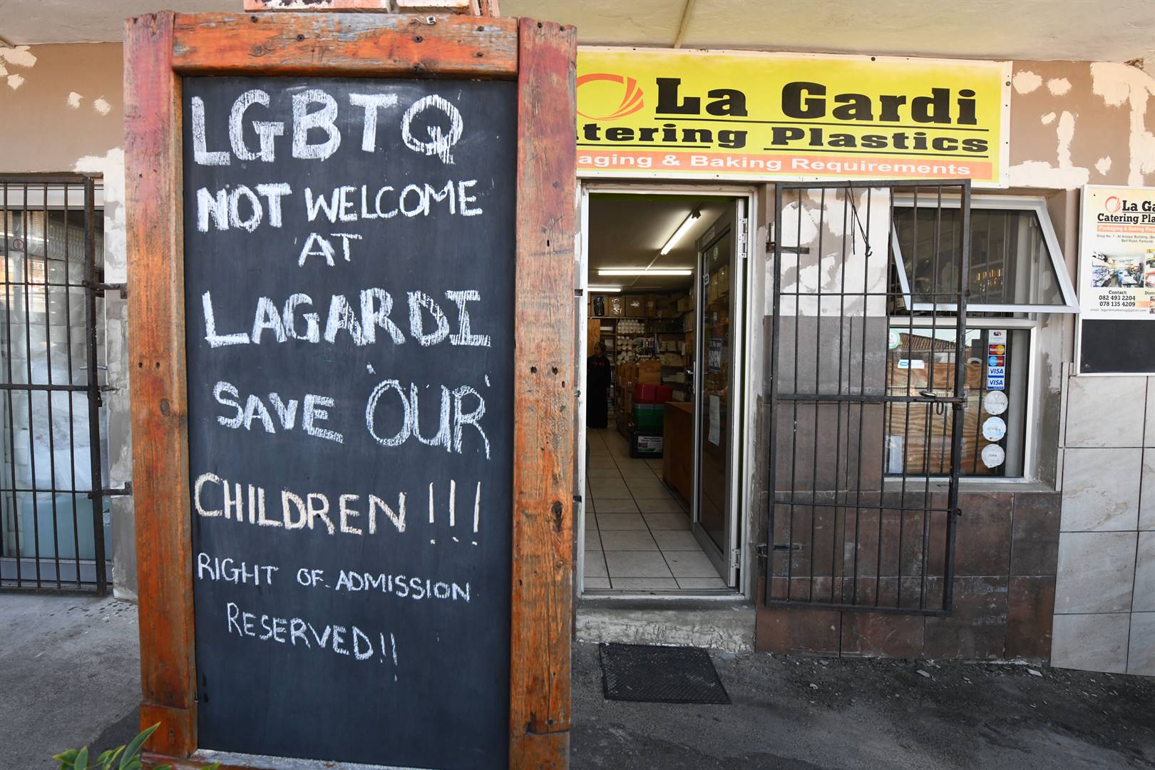 The anti-LGBTQ+ sign has landed a shop owner in big trouble. Photo by Lulama Zenzile/Netwerk24
