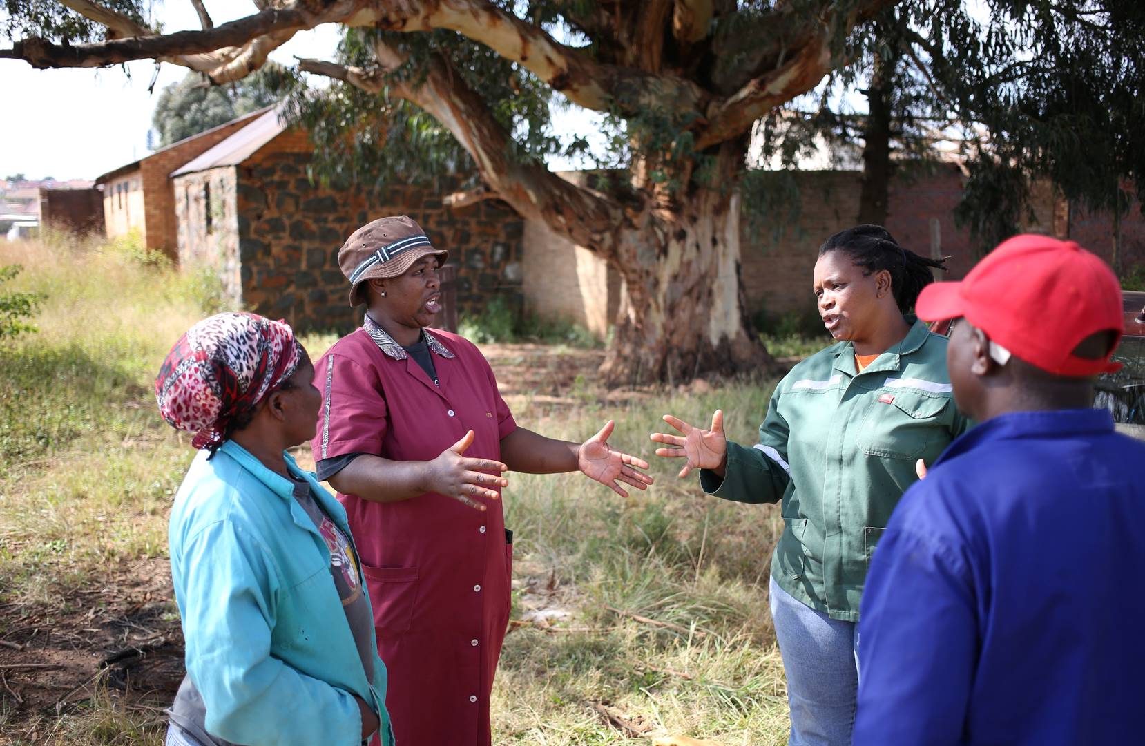 Georginah Sidumo (second from left), co-chairperson of BlueDisa, a cooperative of freehold and subsistence farmers, gestures as she has discussions with other farmers and members of BlueDisa, at Lawley informal settlement in the south of Johannesburg. Picture: Siphiwe Sibeko/Reuters