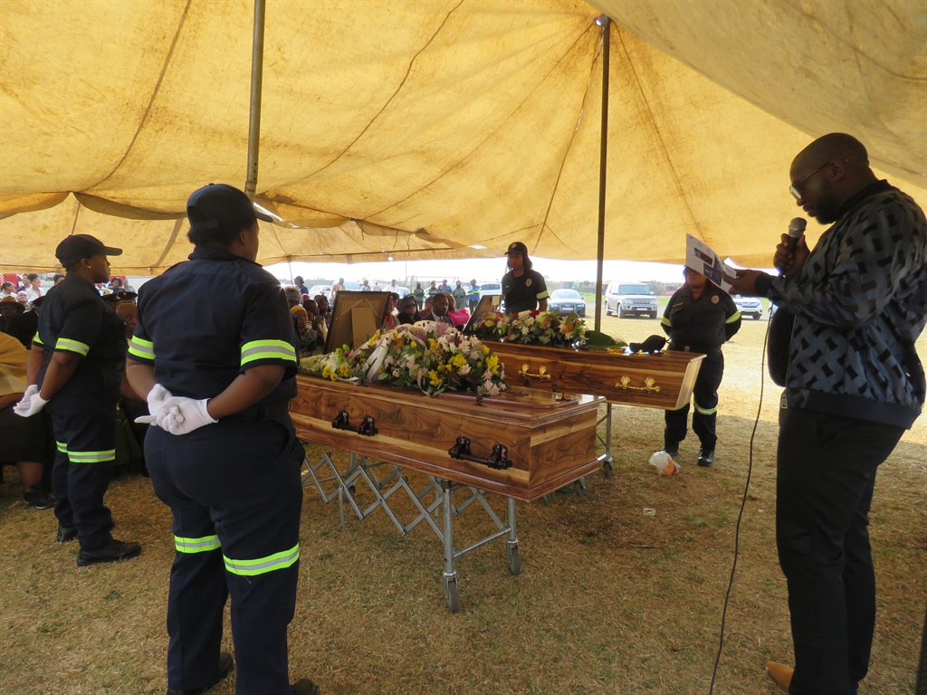 Firefighters paying their last respects to their colleagues. Photo by Ntebatse Masipa
