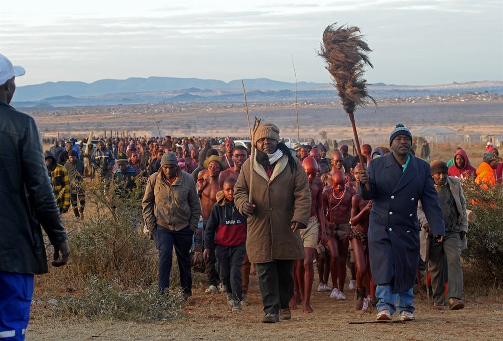 Led by village elders and the chief's headmen, the young and older initiates are leaving the bush for the royal kraal as the season ends.