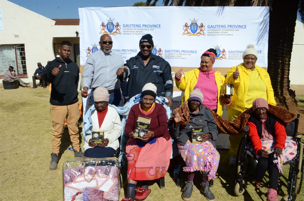 MEC Mzi Khumalo (third from left) with officials donated blankets and food at the kasi centre. Photo by Happy Mnguni