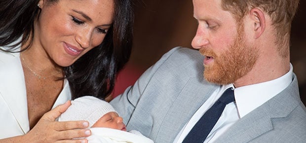 Meghan and Prince Harry pose with their newborn son. (Photo: Getty Images)