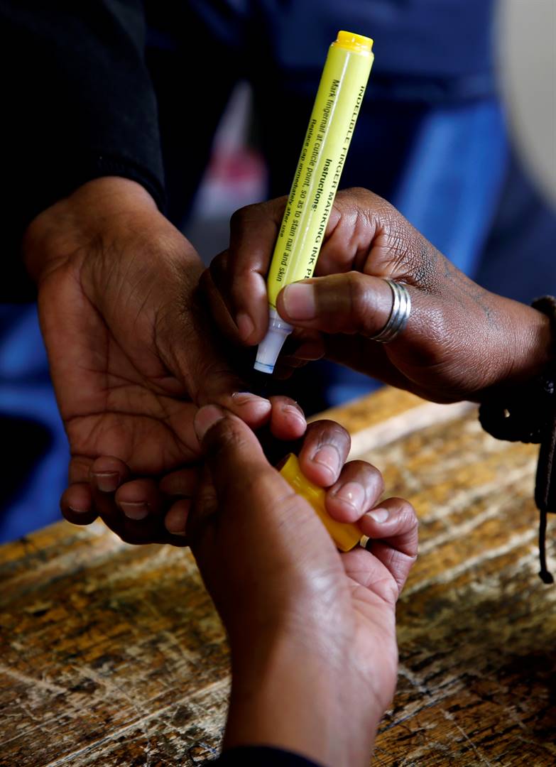 A voter's finger is inked as she casts her ballot at a polling station during South Africa's parliamentary and provincial elections. Picture: Philimon Bulawayo/Reuters
