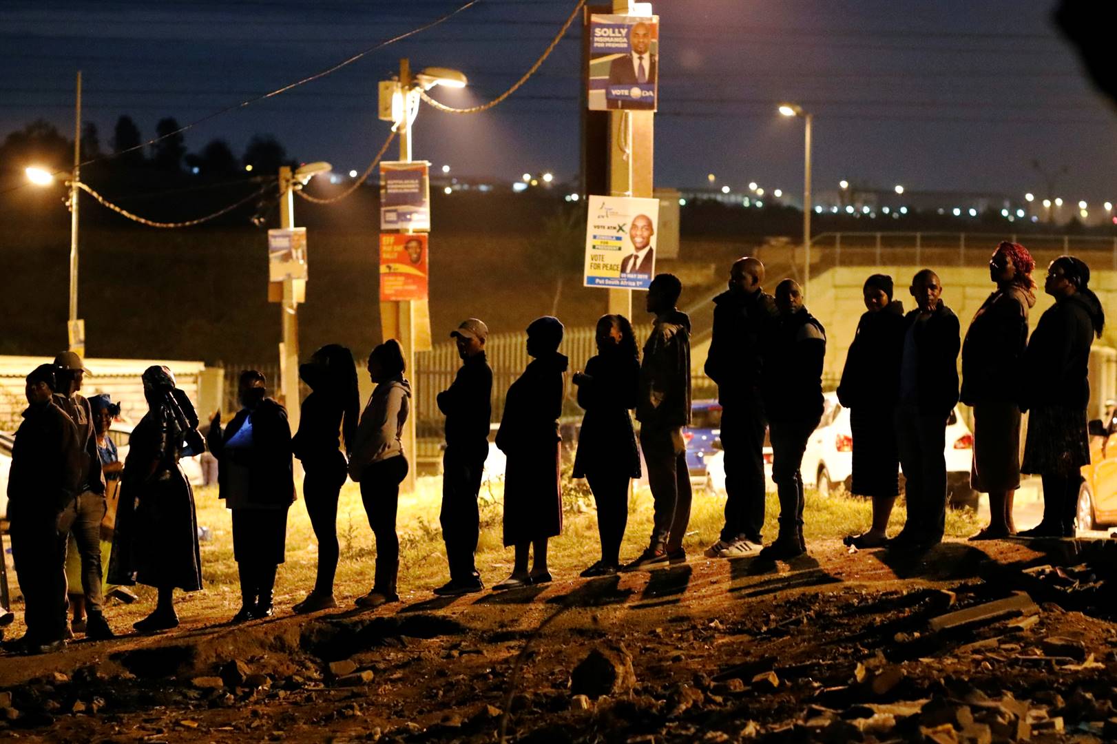 Voters queue to cast their ballots as night falls outside a polling station in Alexandra township in Johannesburg on Wednesday (May 8 2019). Picture: Mike Hutchings/Reuters
