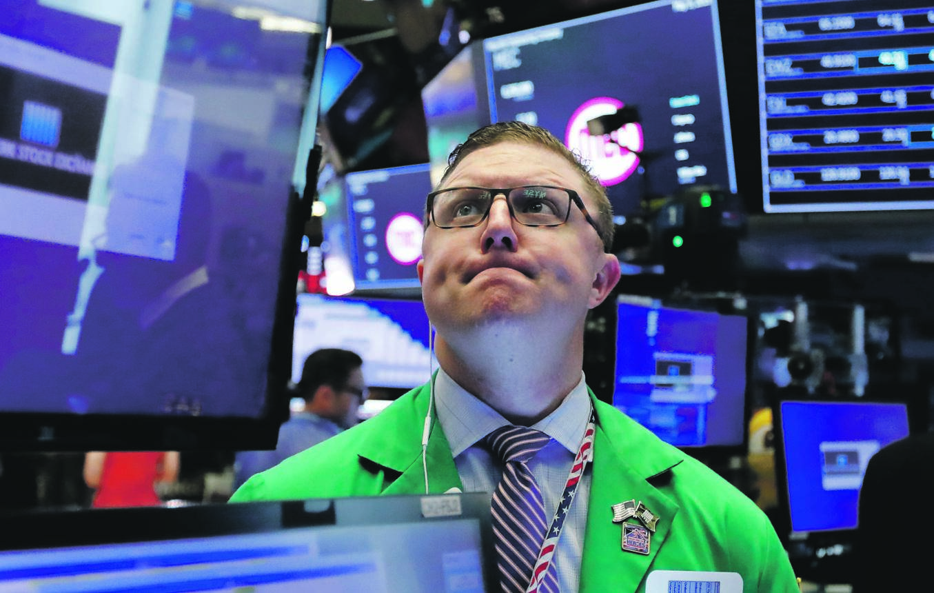 Trader Ryan Falvey works on the floor of the New York Stock Exchange. Stocks came under pressure this week, with investors keeping close tabs on trade talks between the US and China. Picture: AP 