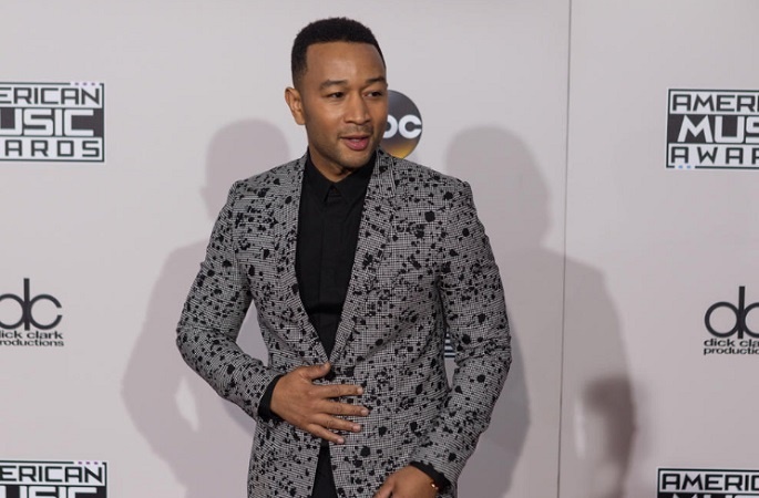 John Legend wants more dads to be "active" when it comes to "diaper-changing duties"